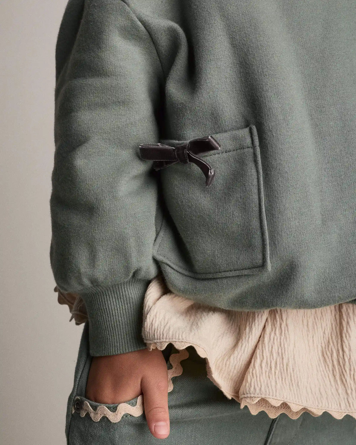 Toddler Girl Otter Sweatshirt™ with Bow Pockets - Olive